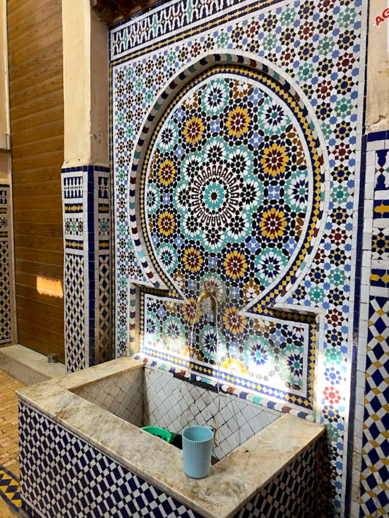 Zellige tile fountain in a Moroccan riad