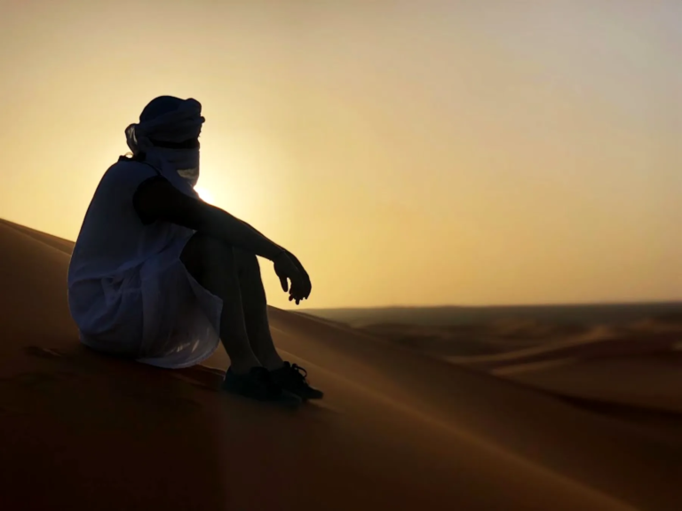 Watching the sunset from a Sahara dune